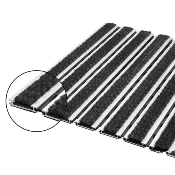 The high-quality doormat is made of robust aluminum slats and a hard plastic insert fitted with dirt-catching strips. The carpet strips made of resistant polyamide ensure optimal dirt and moisture absorption and are highly flammable according to fire protection class Cfl-S1. Due to its high dead weight, the aluminum entrance mat stays perfectly in place in the floor recess and does not form waves, which could otherwise become dangerous tripping hazards. The high-performance aluminum doormat is available in various color variants.